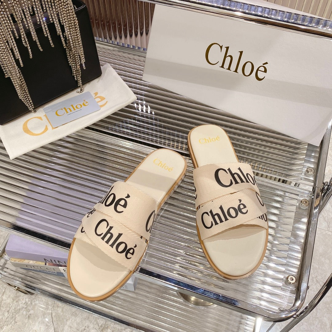 WOODY SLIPPER IN BEIGE MIX BLACK CANVAS