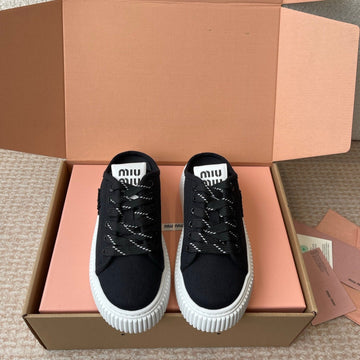 WASH SNEAKER MULES IN BLACK DENIM